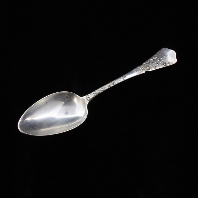 Vintage French Silver Serving Spoon: Est $ 90-160 French serving spoon with a floral rose pattern. The reverse of the handle has a ribbon and crown design that is engraved Palacio De S. Pauio Mocambique, the spoon bear a makers mark and 
