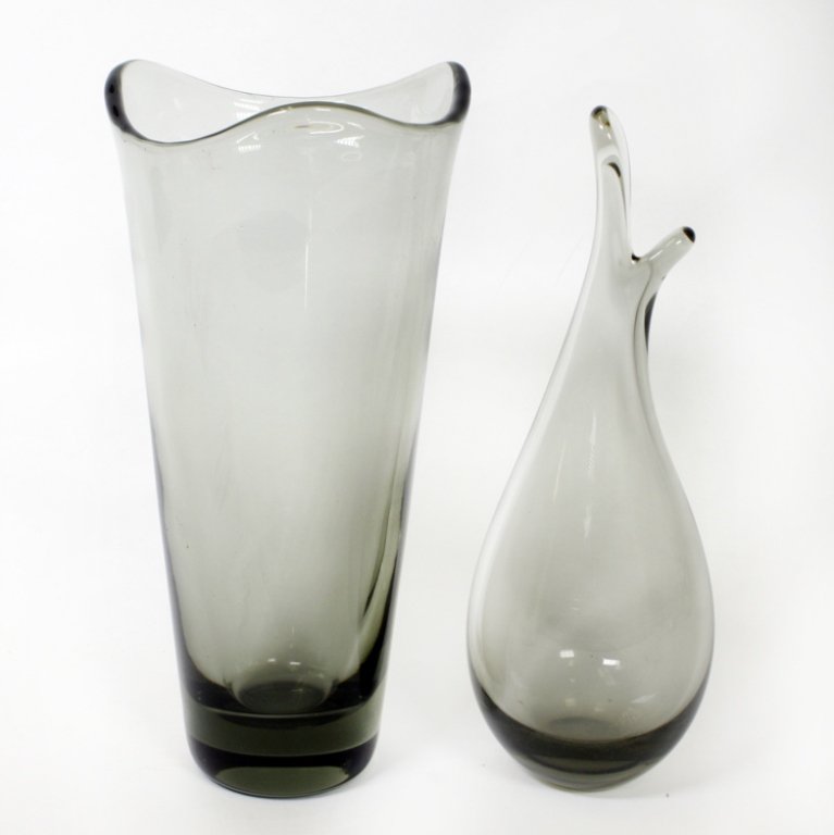Set of Two Per Lutken Holmegaard Vases: Est $ 150-300 Set of two smoked glass vases designed by Per Lutken both signed "Holmegaard". The larger vase bears the date 1956 and measures 9 3/4" tall and the other is a beak vase with the date 195