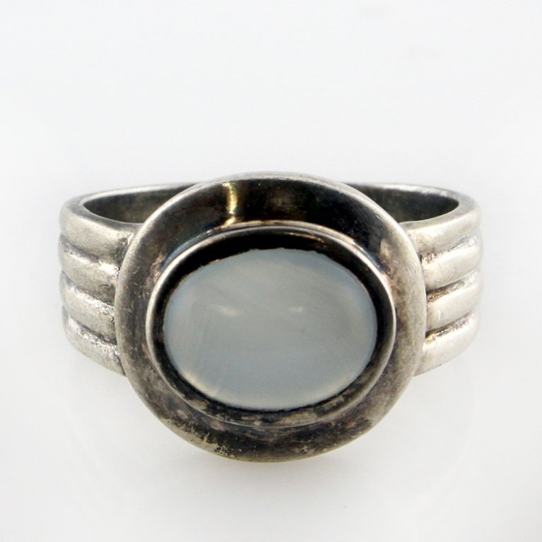 Sterling and Moonstone Ring: Est. $20 - 35 Sterling and Moonstone Ring. Weighs 6.9 grams. Marked 925