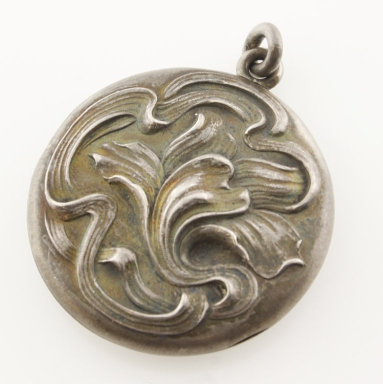 Sterling Art Nouveau Locket: Est. $20 - 30 Sterling Art Nouveau Locket. Weighs 9.3 grams. Marked Sterling. Monogrammed on back.