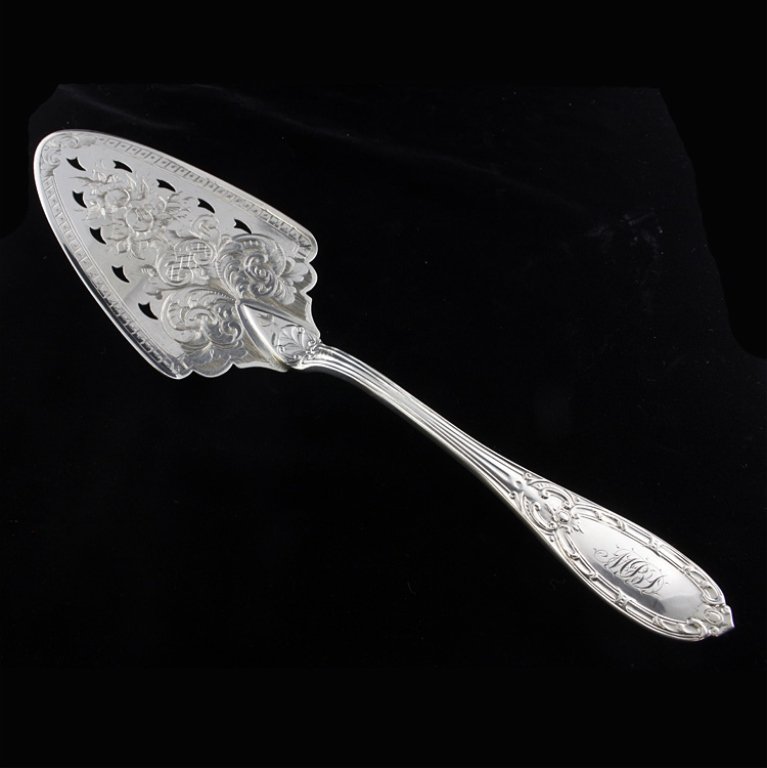 Albert Coles Jenny Lind Pie Server: Est. $240 - 360 Albert Coles Jenny Lind Pie Server. Weighs 3.3 ozt. Pie or pastry server by Albert Coles in the Jenny Lind pattern with an incredibly engraved blade. Measures 10.5 inches.
