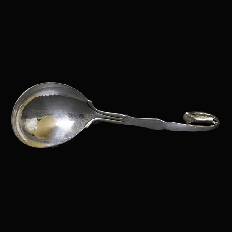 Georg Jensen Blossom Ladle: Est. $360 - 540 Georg Jensen Blossom Ladle. Weighs 2.54 ozt. Blossom variation pattern number 21 or number 141, old production 1931 date. 830 S silver Measures 7.5 inches.