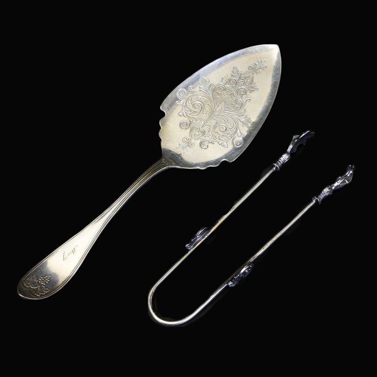 Redfield & Rice Pie Server & Unknown Maker Tongs: Est. $10 - 15 Redfield & Rice Pie Server & Unknown Maker Tongs. Redfield and Rice silverplate pie server with grape and ivy pattern, Silverplate tongs with hands.