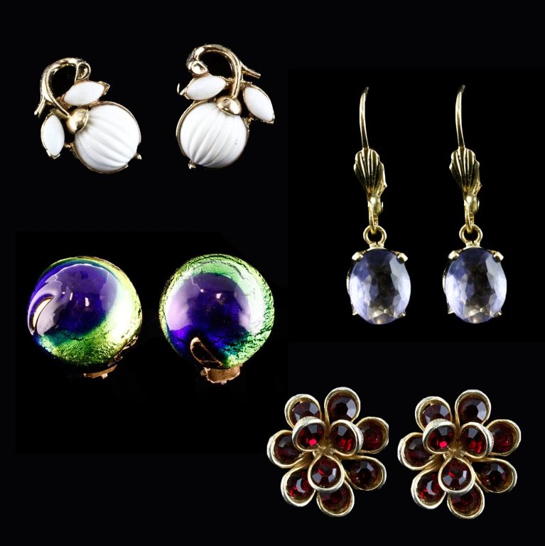 Vtg. Group of Earrings: Est. $30 - 50 Vtg. Group of Earrings . Includes: red rhinestone clip on earrings, Trifari white clip on earrings, Purple-blue clip hook earrings and iridescent round clip style earrings.