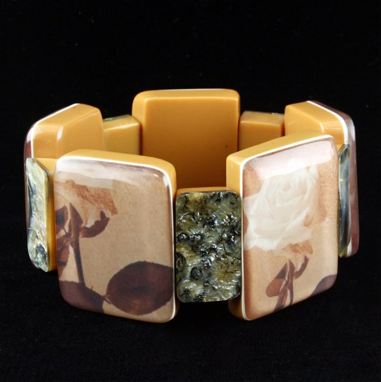 Stretch Bracelet with Abalone & Floral Design: Est. $30 - 50 Stretch Bracelet with Abalone & Floral Design. Bracelet is 2.5 inch opening diameter.