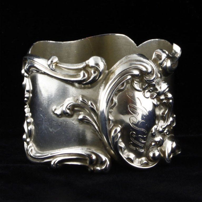 Frank Whiting Napkin Ring: Est. $30 - 50 Frank Whiting Napkin Ring. Weighs 1.09 ozt. Measures 1.375" tall by 1.75" wide. Monogrammed. Marked Frank Whiting, Sterling, 436.