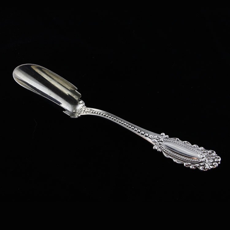 Watson Sterling Silver Cheese Scoop: Est. $30 - 45 Watson Sterling Silver Cheese Scoop. Sterling silver cheese scoop by Watson in the Eugenie pattern. Measures 5 3/8" long. Weighs .86 ozt. Marks: Watson makers mark, sterling.