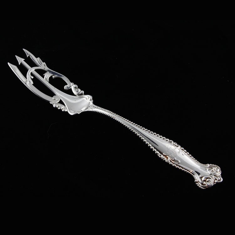 Towle Sterling Silver Pickle Fork: Est. $30 - 45 Towle Sterling Silver Pickle Fork. Sterling silver pickle fork by Towle in the Cantebury pattern, monogrammed "B" on handle. Measures 6 1/8" long. Weighs .91 ozt. Marks: Towle makers mar