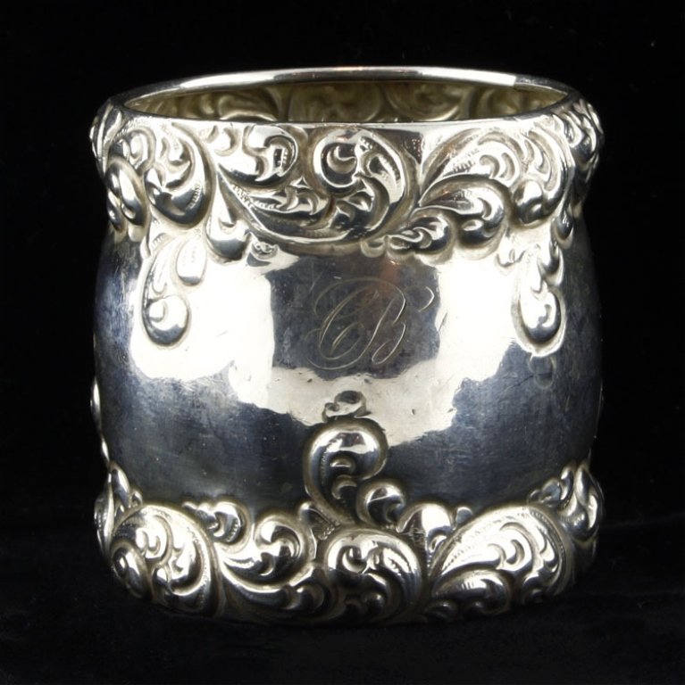 Simons Bros Napkin Ring: Est. $30 - 45 Simons Bros Napkin Ring. Weighs .91 ozt. Measures 1.875" tall by 1.875" wide. Marked Simons Bros, Sterling, 5721