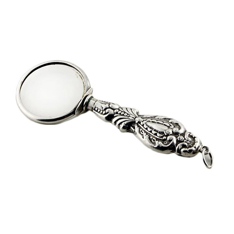 Sterling Handled Magnifiying Glass.: Est. $10 - 20 Sterling Handled Magnifiying Glass. . Weighted handle. Tested for sterling. Measures 3.75" long with bale.