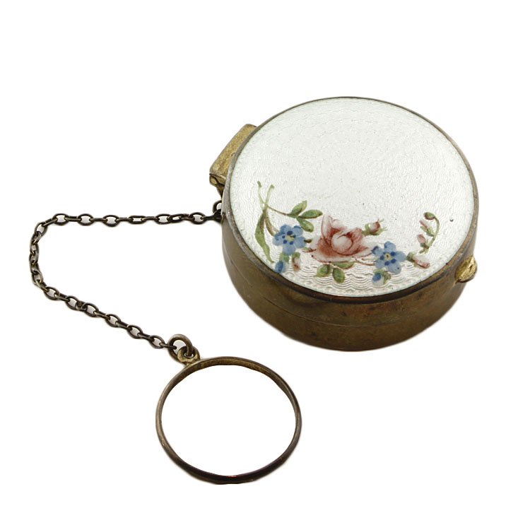 Thomae Enameled Small Compact: Est. $30 - 60 Thomae Enameled Small Compact. Weighs .85 ozt. Measures 1.5" across. Has 3" chain. Mirror inside. Marked The Thomae Co., Sterling, T, 583.