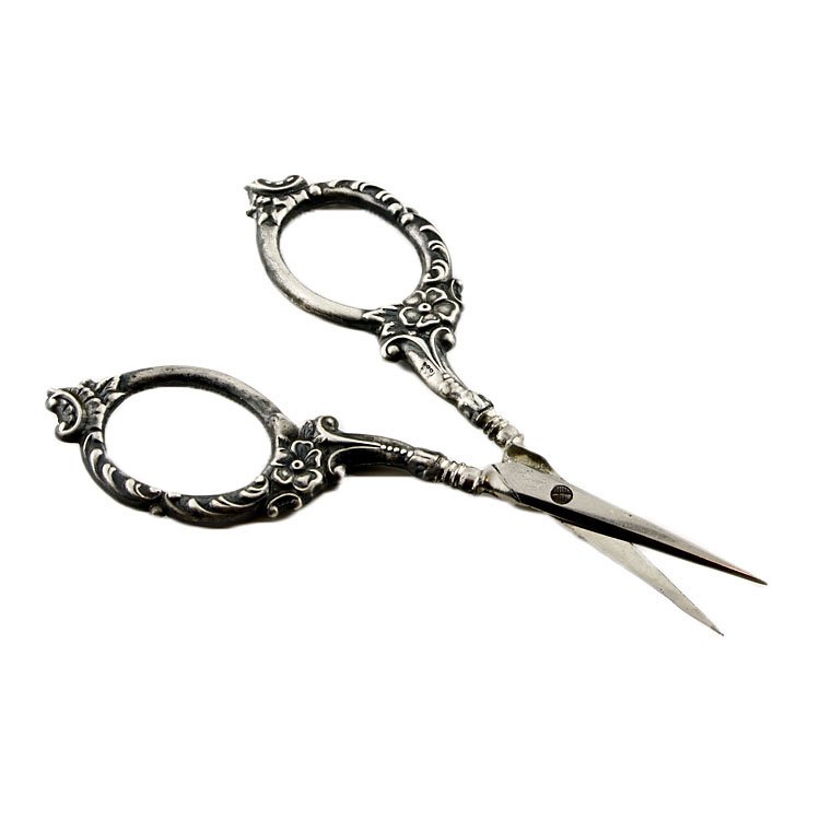 Sterling Thread Scissors: Est. $10 - 20 Sterling Thread Scissors. Weighs .33 ozt. Handles marked 925/1000. Measures 4" long.