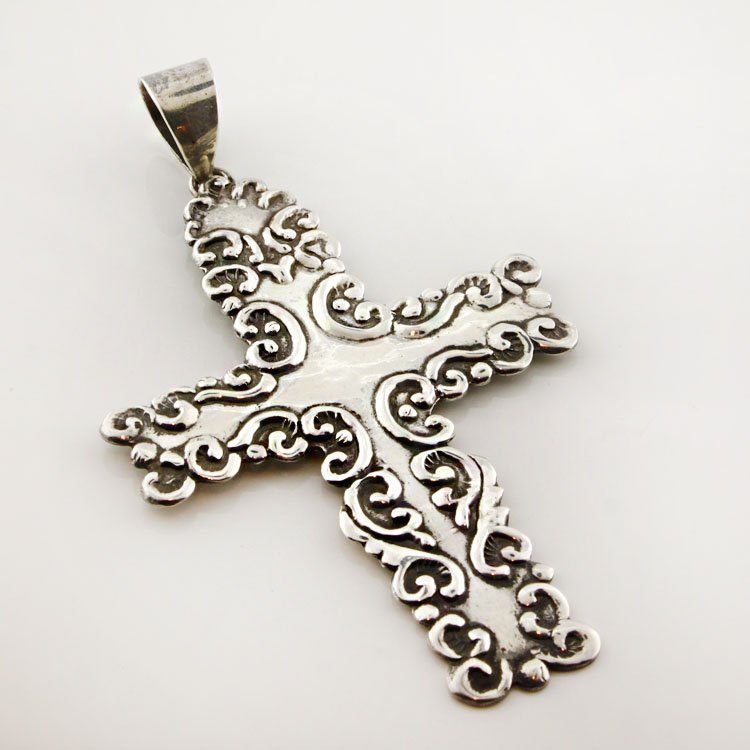 Sterling Cross Pendant: Est. $30 - 50 Sterling Cross Pendant. 11 gr. Pendant is 3 1/4 x 2". Marks: Thailand & 925.
