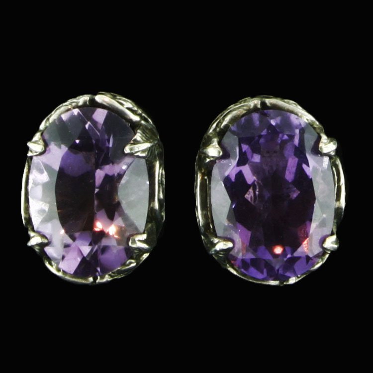 Sterling and Amethyst Earrings: Est. $50 - 75 Sterling and Amethyst Earrings. 8.6 gr tw. Sterling. Gemstones: (2) Amethyst, oval faceted. 14 x 10mm each approx. Marks: 97 & 925.