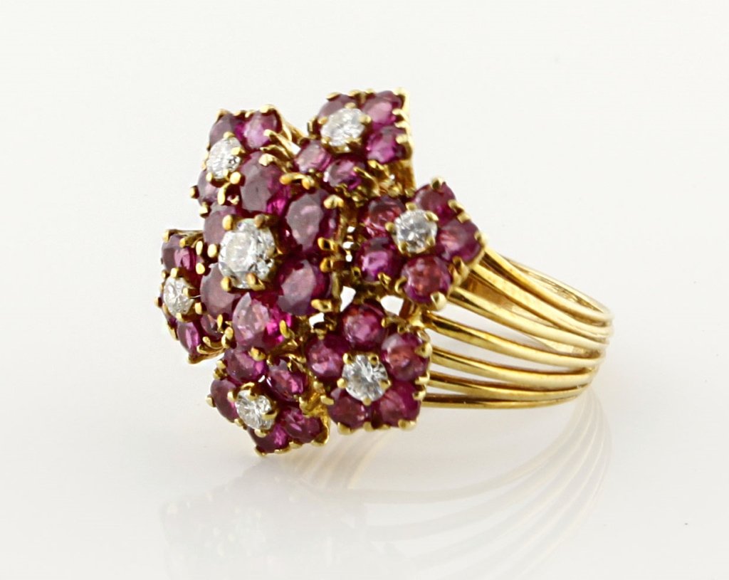 18k Ruby & Diamond Ring: Est. $800 - 1200 18k Ruby & Diamond Ring. Vintage Diamond and Ruby Ring in 18k yellow gold. 8.3gr tw. Diamonds: (6) .06-.07 ct each round brilliant VS colorless. (1) .23 ct round brilliant SI colorl