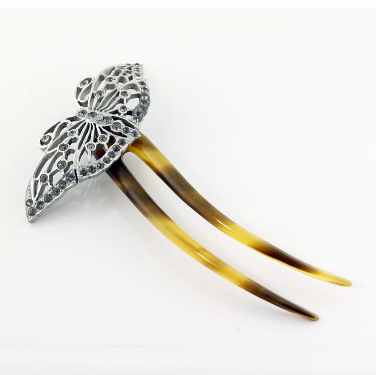 Vintage Butterfly Hair Comb: Est. $30 - 50 Vintage Butterfly Hair Comb. Tortoise shell comb with butterfly attachment with clear stones. Missing one stone. 4 11/4 x 2 3/4".