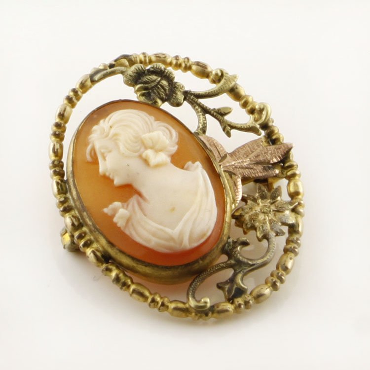 Vintage Cameo Pin Brooch in Gold: Est. $50 - 100 Vintage Cameo Pin Brooch in Gold. Gold filled pink and yellow gold pin brooch with natural shell cameo. 1 1/8 x 7/". Marks: 1/20th 12k GF.