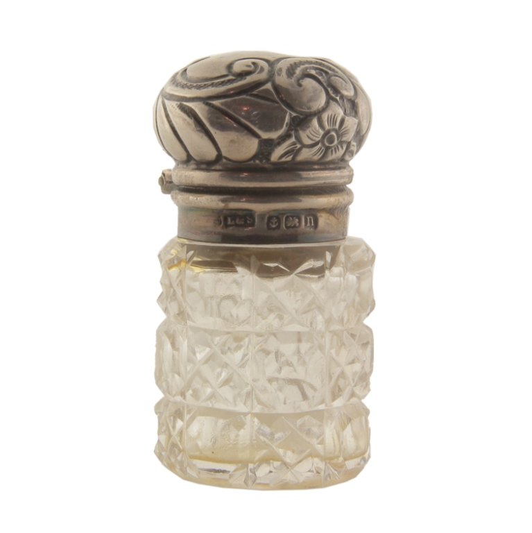 Levi & Salaman Sterling and Crystal Perfume Bottle: Est. $30 - 50 Levi & Salaman Sterling and Crystal Perfume Bottle. Weighs .97 ozt including glass. Measures 2" tall. Marked Levi & Salaman, Anchor, Lion, 1902. Some perfume residue. Stopper included.