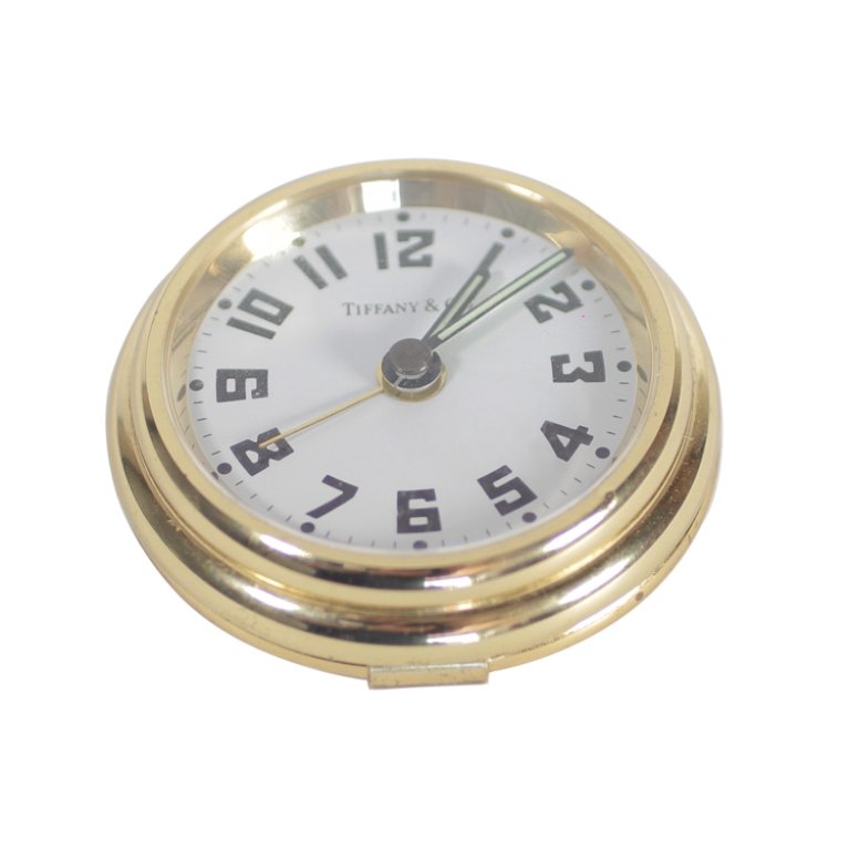Tiffany & Co. Aviator Travel Alarm Clock: Est. $100 - 200 Tiffany & Co. Aviator Travel Alarm Clock. Marked Tiffany & Co. Made in Germany. This alarm clock is 2 1/2" diameter. Unknown working condition.