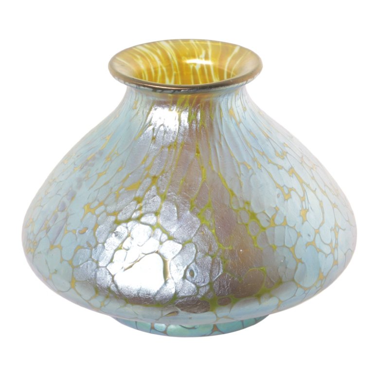 Glass Iridized Jar: Est. $200 - 300 Glass Iridized Jar. Early 20th century. Unsigned possibly Loetz. 3 1/4" tall. Third Party Shipping