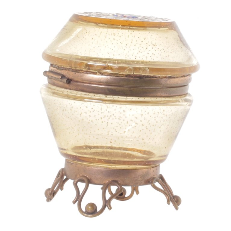Piano Hinged Glass Box: Est. $30 - 40 Piano Hinged Glass Box. 20th century. Enamel floral with metal stand. 3 1/2" tall. Third Party Shipping