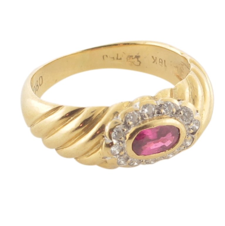 Ruby & Diamond Ring in 18k Gold: Est. $300 - 650 Ruby & Diamond Ring in 18k Gold. 18k yellow gold 4.3gr. Gemstones: Center Ruby oval faceted. 5.75 x 3.50mm. Accents: Diamonds (12) .005-.01ct each. .10ct tw approx. Round Brilliant I w