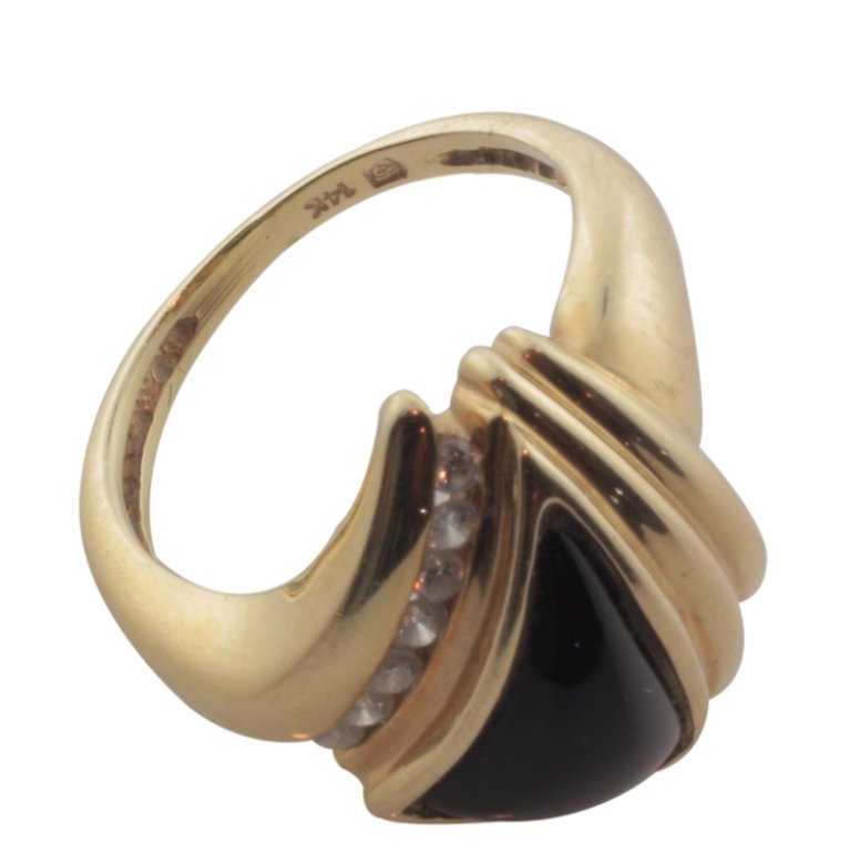 Black Onyx & Diamond Ring in 14k Gold: Est. $250 - 500 Black Onyx & Diamond Ring in 14k Gold. 14k yellow gold. 5.0gr tw. Gemstones: Black Onyx. Accents (7) .015-.020 each. .15ct tw approx. SI near colorless.