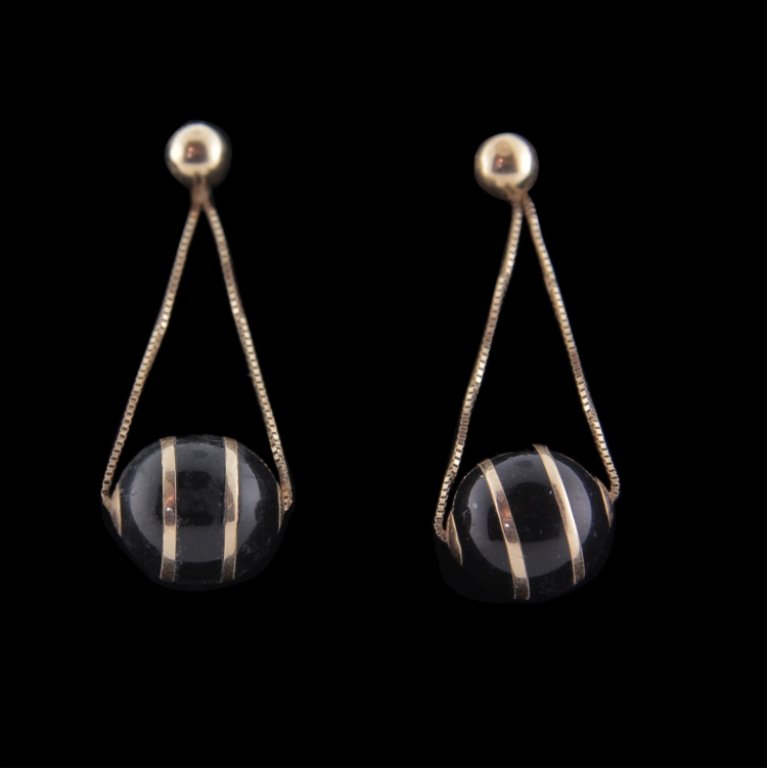 Ball Dangle Style 14k Earrings: Est. $125 - 225 Ball Dangle Style 14k Earrings. 14k yellow gold. 2.8gr. Black enamel and gold ball swivels on chain. Ball is 11mm in diameter, 1 3/8" overall length.