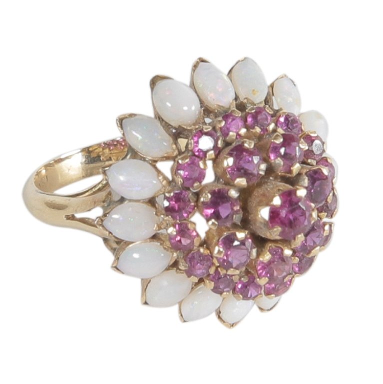 Vintage Ruby & Opal Ring in 18k: Est. $500 - 1000 Vintage Ruby & Opal Ring in 18k. 18k yellow gold. 5.41gr tw. Gemstones: Ruby, round mixed cut. Opals, marquise cabochon.