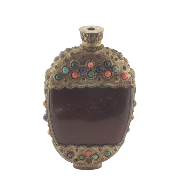 Stone Bottle: Est. $50 - 75 Stone Bottle. 20th century. Bottle has ormolu mounts and inlaid stones. Missing some stones. 4" tall.