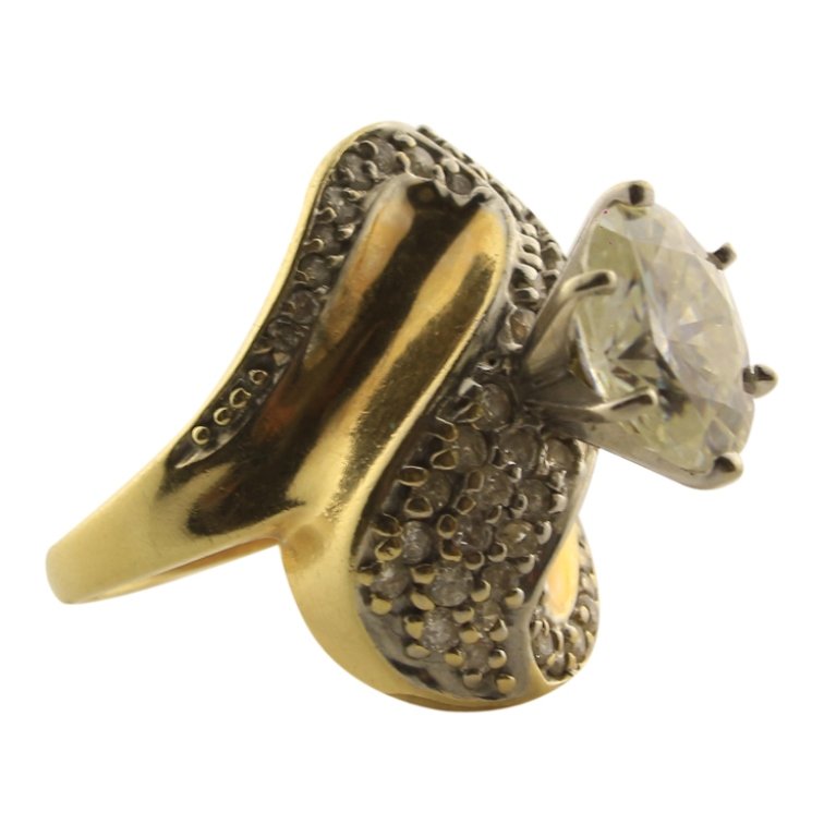 Diamond 14k Ring with Moissanite Center Stone: Est. $600 - 1000 Diamond 14k Ring with Moissanite Center Stone. 14k yellow gold. 8.4gr tw. Gemstones: Center 2.50ct approx. Moissanite Diamond. Tests as Moissanite. Accents: Diamonds 1.00ct tw approx.