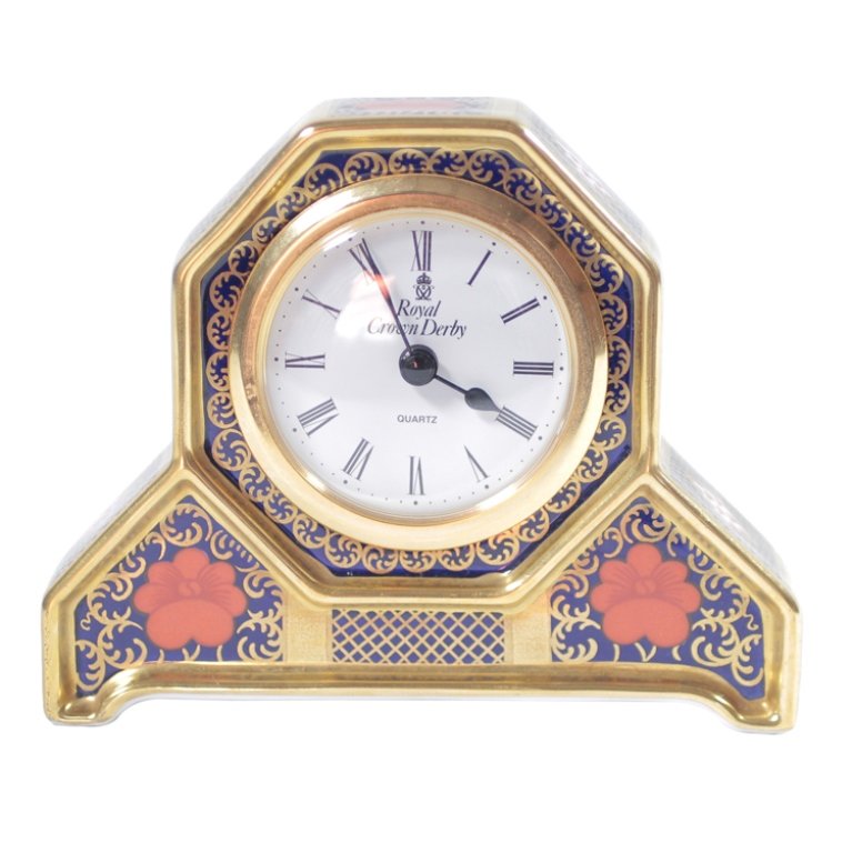 Royal Crown Derby Old Imari Desk Clock: Est. $100 - 150 Royal Crown Derby Old Imari Desk Clock. Royal Crown Derby Old Imari desk clock. Marked 1128 and LVII on bottom. Aprox. 4" tall x 5" wide.