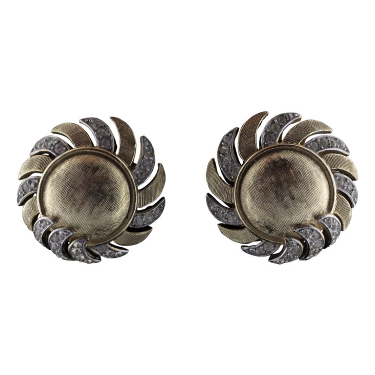 Vintage Trifari Sun with Rhinestone Earrings: Est. $10 - 15 Vintage Trifari Sun with Rhinestone Earrings. Marked crown over T Trifari. Earrings are 1" diameter.