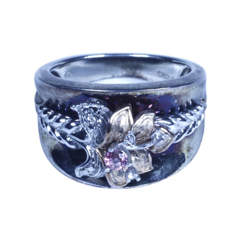 Floral Sterling Ring: Est. $30 - 50 Floral Sterling Ring. Weighs 11.4 grams. Marked 925, China. Size 9.5.