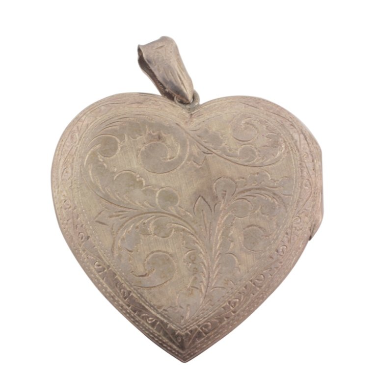 Vintage Sterling Heart Locket: Est. $100 - 150 Vintage Sterling Heart Locket . Sterling 21.4gr. Brite cut design. 2 1/4 x 13/4". Two windows.