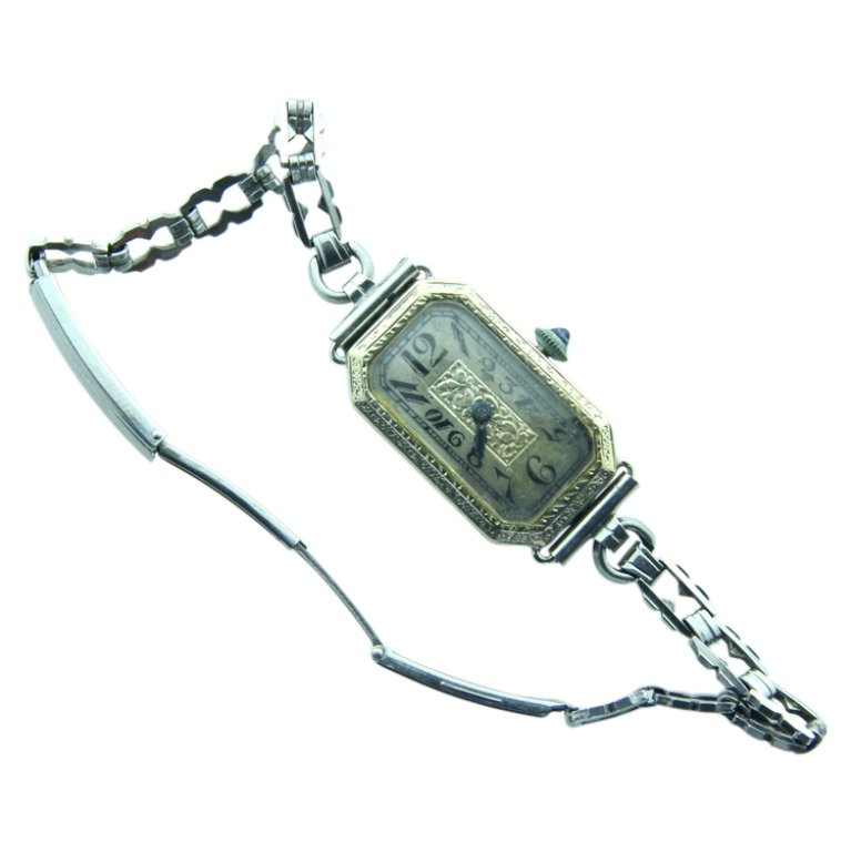 Bulova 18k Ladies Art Deco Watch: Est. $100 - 200 Bulova 18k Ladies Art Deco Watch. Weighs 15.9 grams including movement and chain. Running.