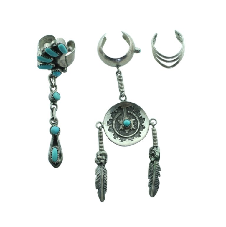 Designer Zuni & Navajo Earrings: Est. $150 - 300 Designer Zuni & Navajo Earrings. Sterling 8.0gr tw. (3) cuff earrings. Includes: Don Jameson Navajo and Bill & Lou Zuni design. Navajo crescent design 2 1/8" long. Zuni design 2 1/2" l