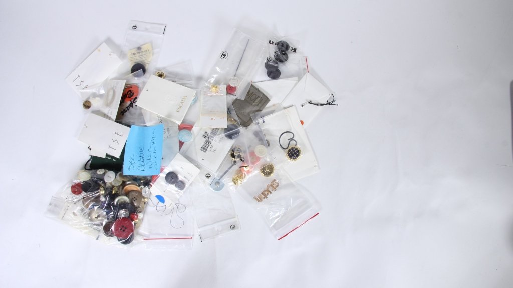 Designer Marked & Unmarked Buttons: Est. $60 - 80 Designer Marked & Unmarked Buttons. Buttons include: Chanel, St. John, Rykiel, Emanuel Ungaro, YvesSaintLaurent, Burberry, Gruppo GFT, Rena Lange, Vittadini, Maggy London, DKNY, BIS Pari