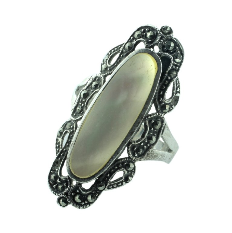 Mother of Pearl, Marcasite and Sterling Ring: Est. $20 - 40 Mother of Pearl, Marcasite and Sterling Ring. Weighs 4.6 grams. Tested for sterling.