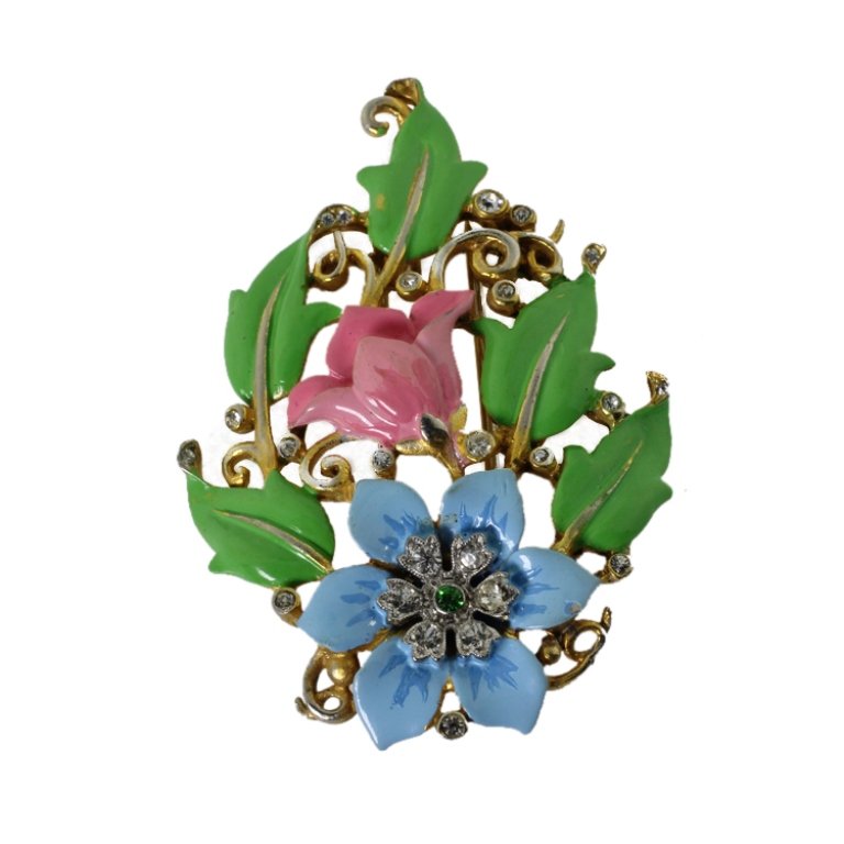 Vintage Crown over Trifari Clip Brooch: Est. $ 40 - 60 Vintage Crown over Trifari Clip Brooch. Painted enamel and rhinestone. Some loss to enamel. 1.25 x 2.25". Marked with Crown over Trifari.