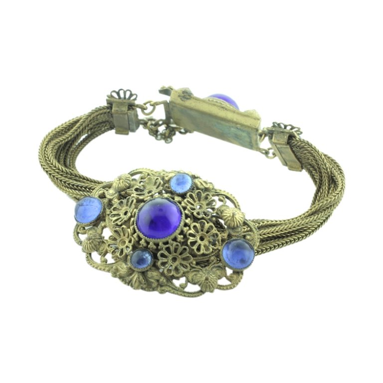 Vintage Filigree, Gemstone & Mesh Bracelet: Est. $75 - 100 Vintage Filigree, Gemstone & Mesh Bracelet. Unmarked bracelet has safety chain, blue gemstones and is 7.25" long.