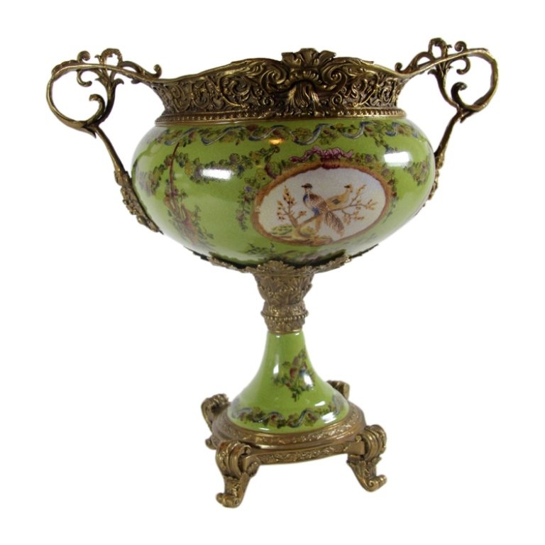 Modern Footed Centerpiece: Est. $ 100 - 150 Modern Footed Centerpiece. With ormolu mounts. Green ground with floral on exterior and decorative transfers. Beige ground interior. Circa 21st century. 14" tall.