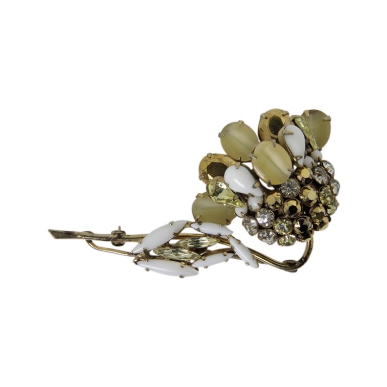 Vintage Schreiner New York Floral Brooch: Est. $ 250 - 400 Vintage Schreiner New York Floral Brooch. Gold tone floral theme brooch with cabachon and rhinestones. 2.5 x 1.5 inches. Marked Schreiner New York.