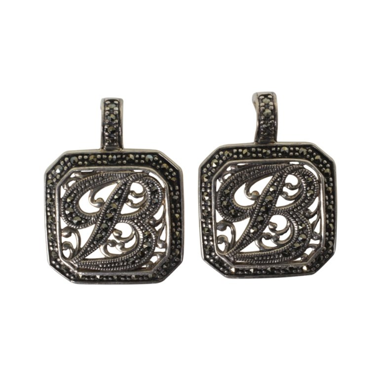 Pair of Sterling and Marcasite Pendants: Est. $ 25 - 35 Pair of Sterling and Marcasite Pendants. Weighs 15.2 grams total. Marked 925, Thailand