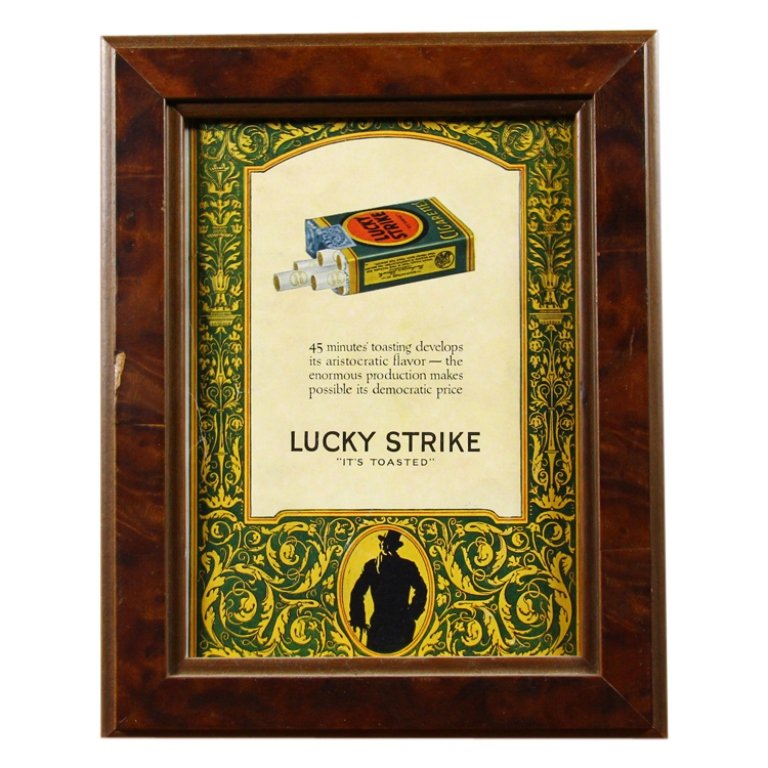 Lucky Strike Framed Advertisement: Est. $ 30 - 50 Lucky Strike Framed Advertisement Measures 8.125 inches tall by 6 inches wide. Wooden frame. Cardboard backing.