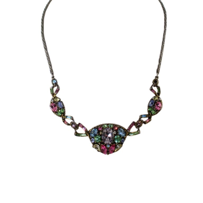 Hollycraft Rhinestone Necklace: Est. $ 50 - 100 Hollycraft Rhinestone Necklace. Silver tone necklace with multi colored rhinestones. Missing stone. Marked Hollcraft COPR 1955. 21 inches long.