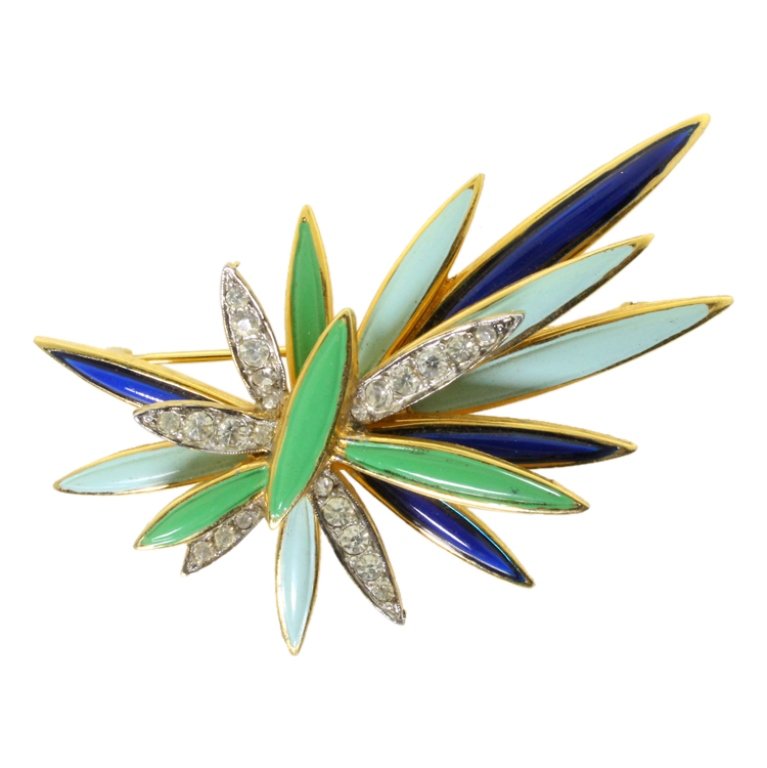 Jomaz Brooch with Rhinestones: Est. $ 30 - 75 Jomaz Brooch with Rhinestones. Gold tone brooch with painted enamel accents and rhinestones. Marked Jomaz. 2 3/8 inches long.