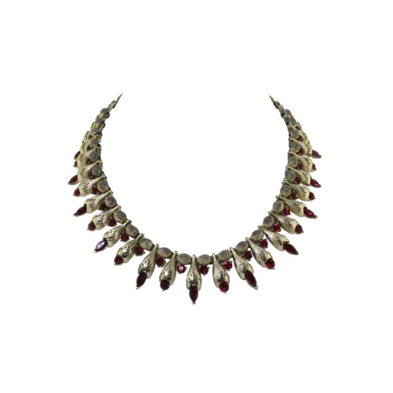 Vintage Coro Gold & Red Rhinestone Necklace: Est. $ 25 - 50 Vintage Coro Gold & Red Rhinestone Necklace. Gold tone necklace with red rhinestones. Marked Coro. 17.5 inches long.