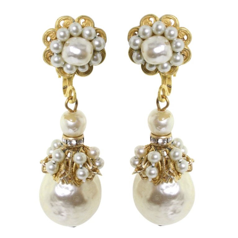 Lawrence Vrba Faux Pearl Earrings: Est. $ 50 - 100 Lawrence Vrba Faux Pearl Earrings. Measures 2 inches long. Made by L. Vrba from his old Miriam Haskell findings.