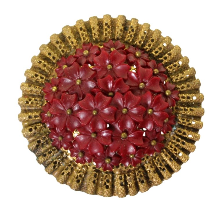 Vintage Floral Dress Clip: Est. $ 50 - 90 Vintage Floral Dress Clip. Antiqued gold dress clip with molded flower at center. 2 3/8 inch diameter.